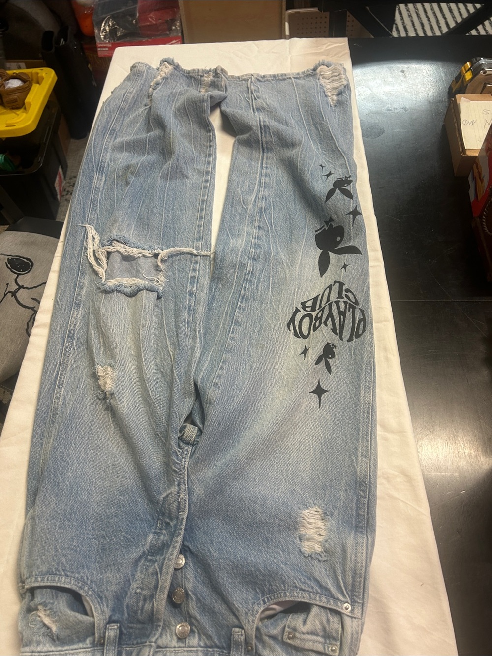 Light Wash Distressed Jeans with Black Graphic